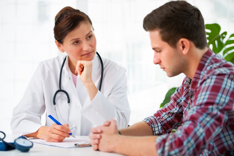 Nurse chats to clinical trials patient at MAC Clinical Research