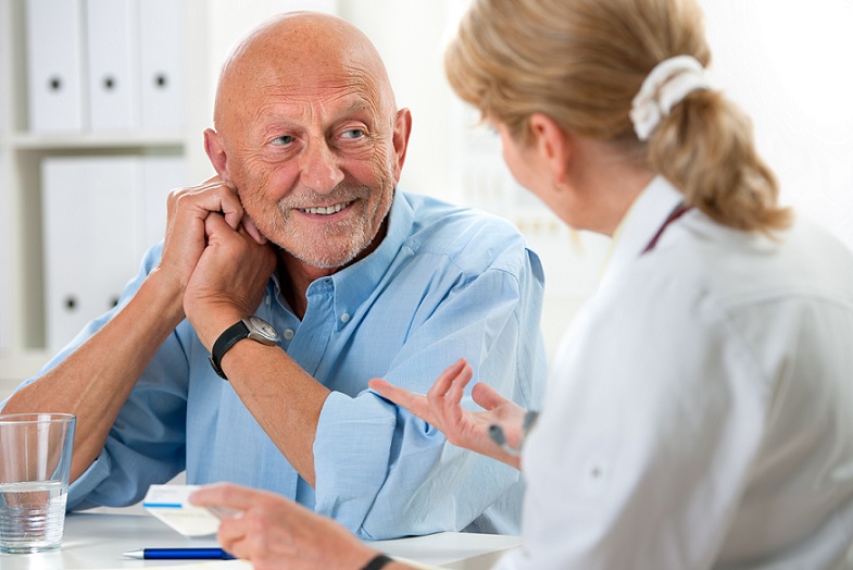 MAC Clinical Research doctor explains medical trial to patient